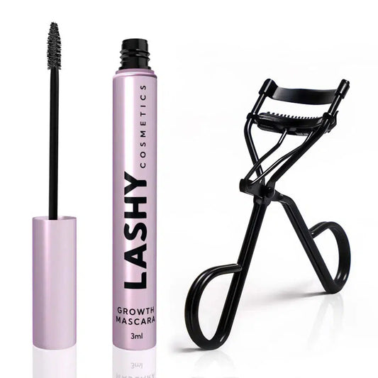 Pink Lashy Cosmetics mascara bottle with lid off, applicator to the left and black Lashy eyelash curler to the right.